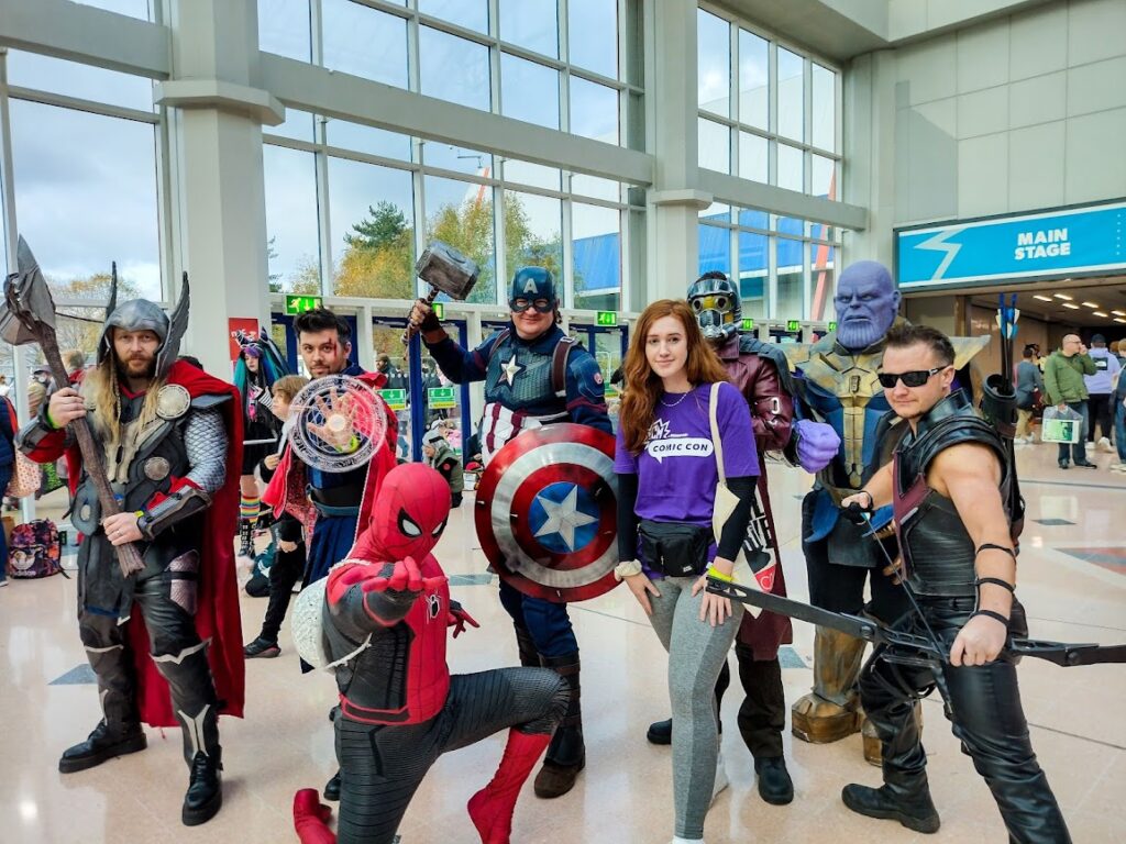Me at comic con posing with cosplayers - spider man, hawkeye, thor, captin america, thanos, dr strange and ant man?
